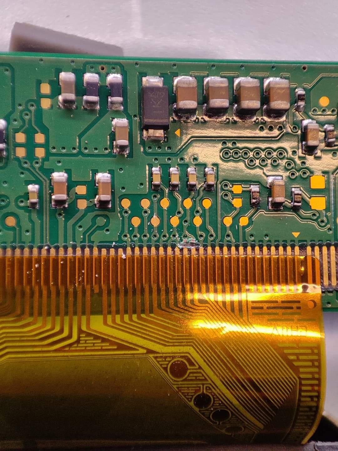Mastering the First Impression: Your intriguing post title goes here Extreme close-up of SMD capacitors and resistors on a TV T-Con board.